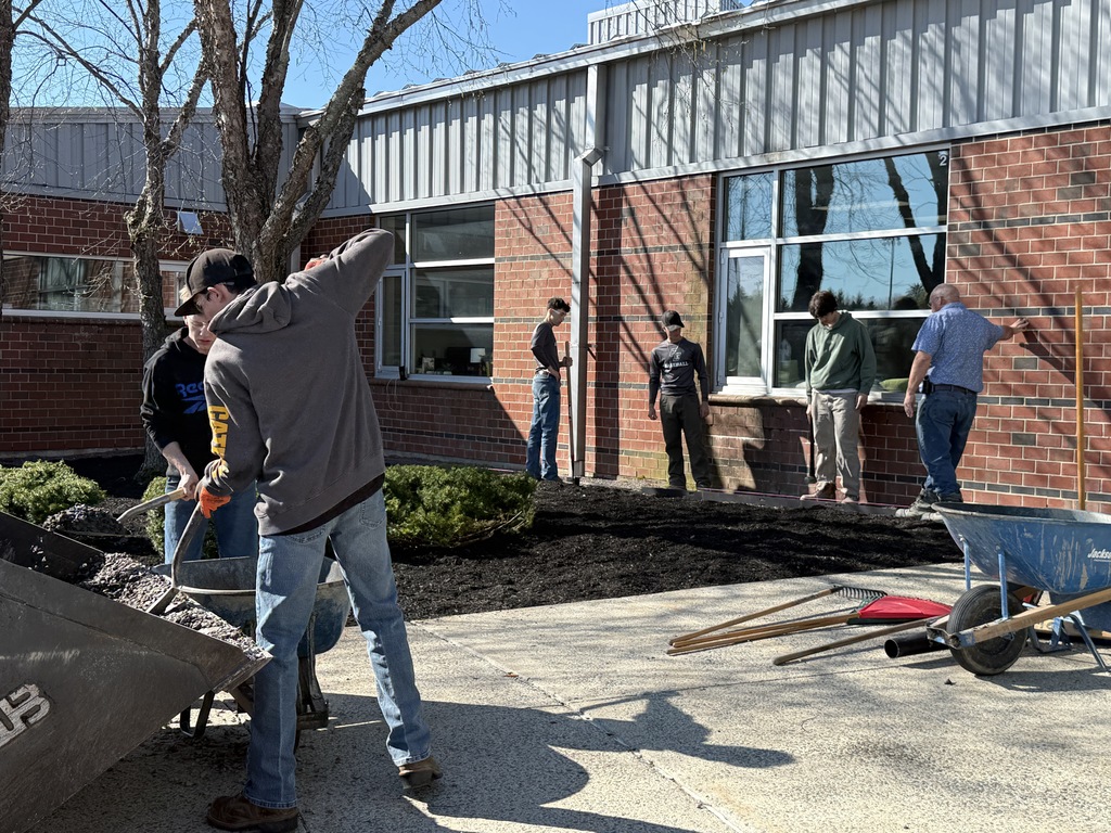 HEO students working on the front entrance