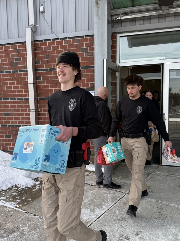 Criminal Justice Students loading the donations
