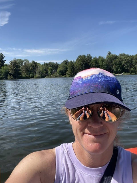 image of a lady in a boat on a sunny day