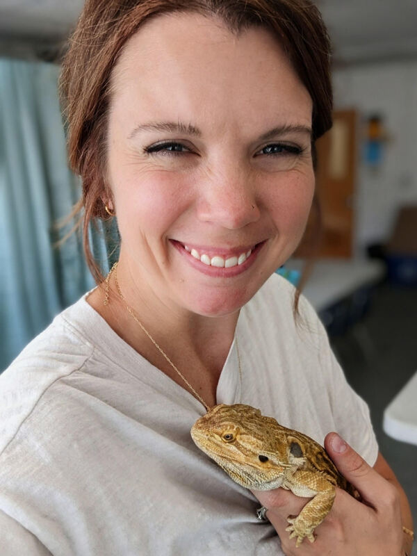 Image of a lady with her pet lizard