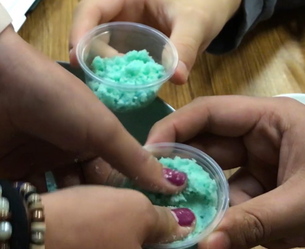 8th graders making bath bombs in science class