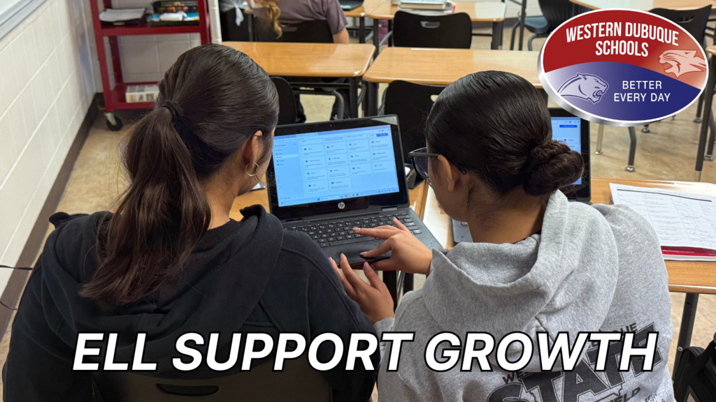 Two students working on laptop