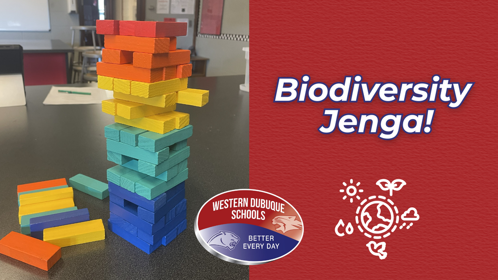 Graphic featuring a colorful Jenga tower made of red, orange, yellow, green, blue, and purple blocks on a classroom table. The text on the right reads “Biodiversity Jenga!” alongside the Western Dubuque Schools logo with the tagline “Better Every Day” and a white environmental icon with leaves, water, and the sun.