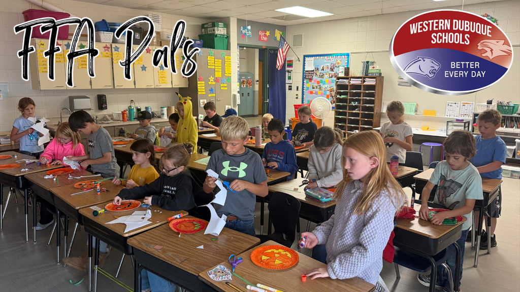A classroom of elementary students works on a fall-themed craft project using orange paper plates, glue, and scissors. Some students are cutting shapes while others decorate their plates at their desks. Text on the image reads “FFA Pals,” and the Western Dubuque Schools “Better Every Day” logo appears in the upper right corner.