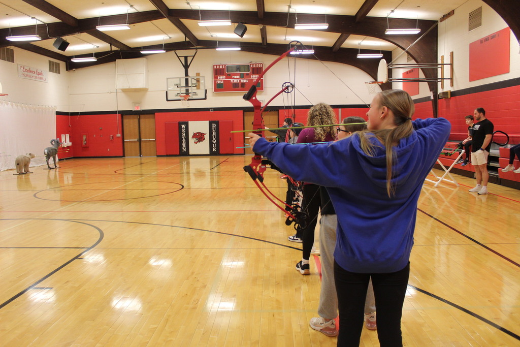 PE is learing about archery with Coack K. 