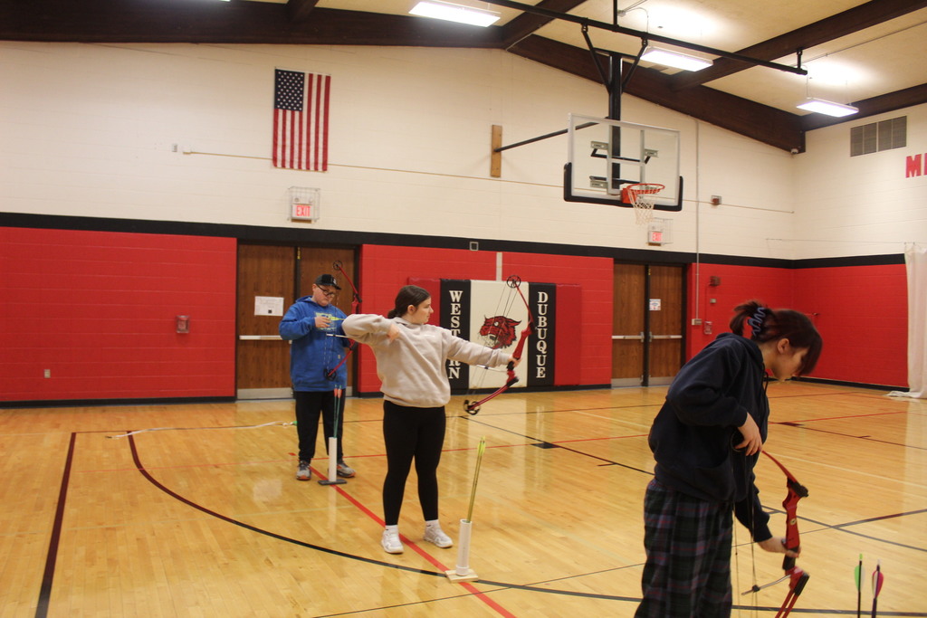 PE is learing about archery with Coack K. 