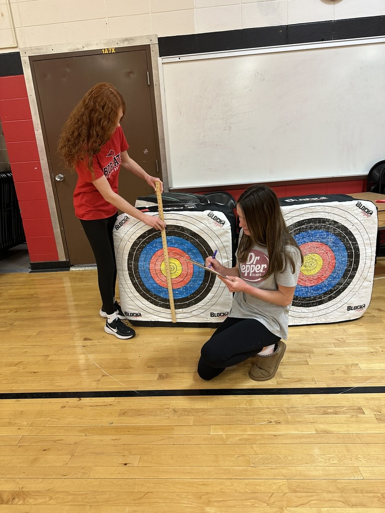 7th & 8th graders doing a "Pi Day" scavenger hunt