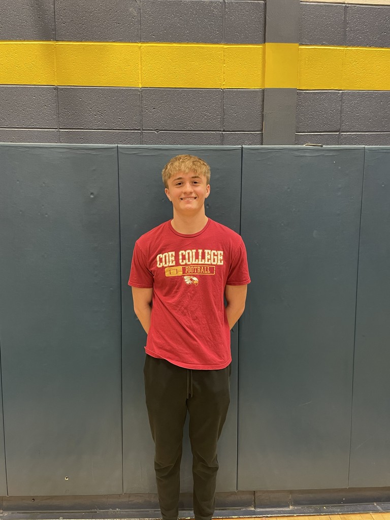 Student wearing a Coe College shirt.