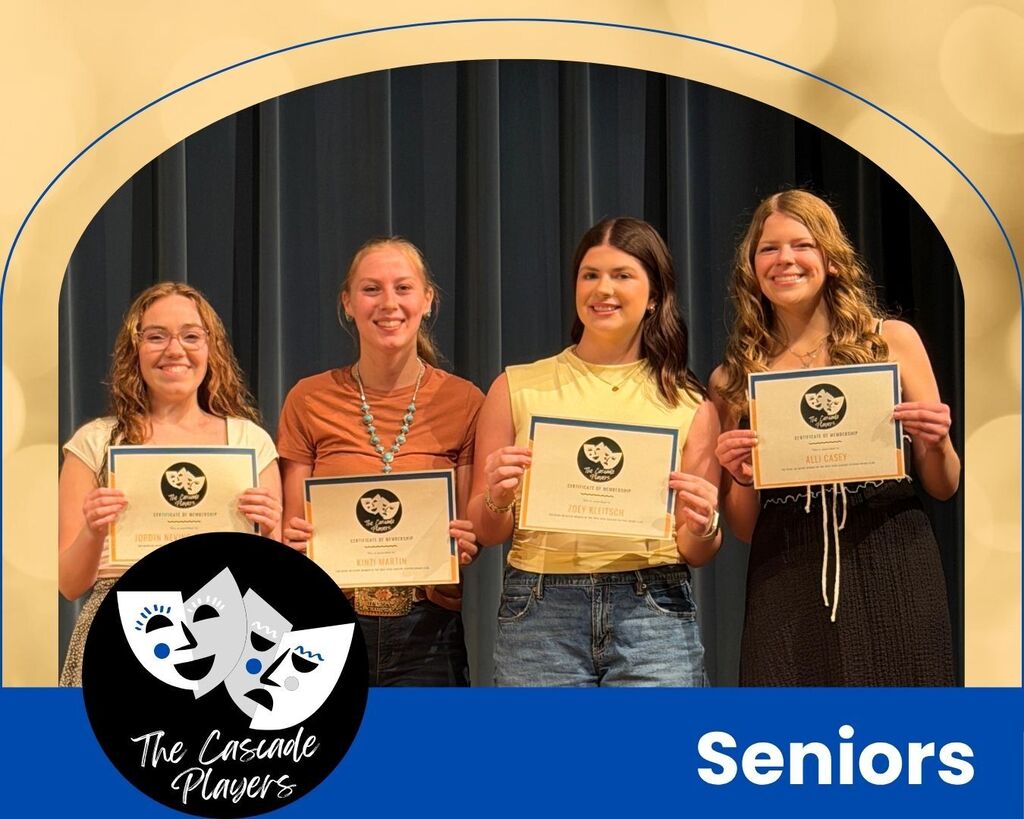 Four girls holding up certificates.
