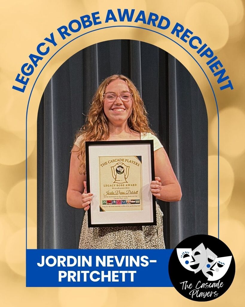 Student holding up a framed certificate