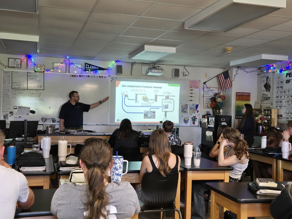 Man presenting to classroom of students.