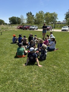 Group of kids sitting in the grass