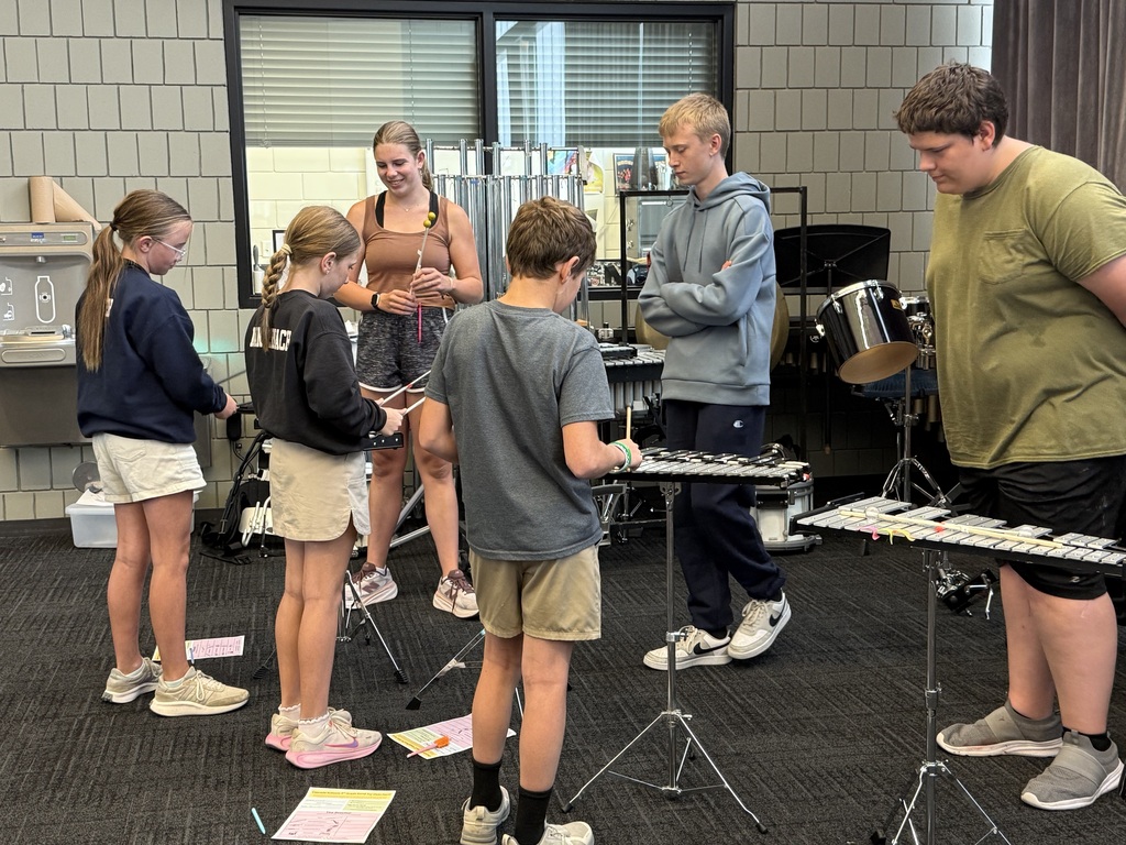 Students playing the bells.