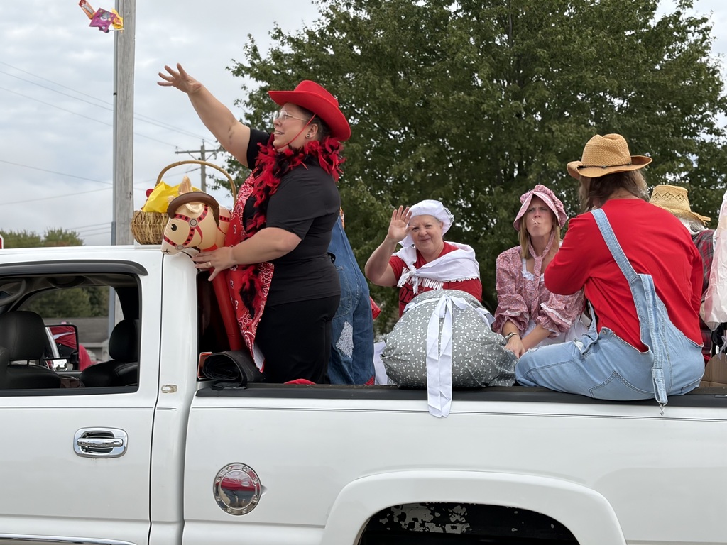 Adults on a parade float