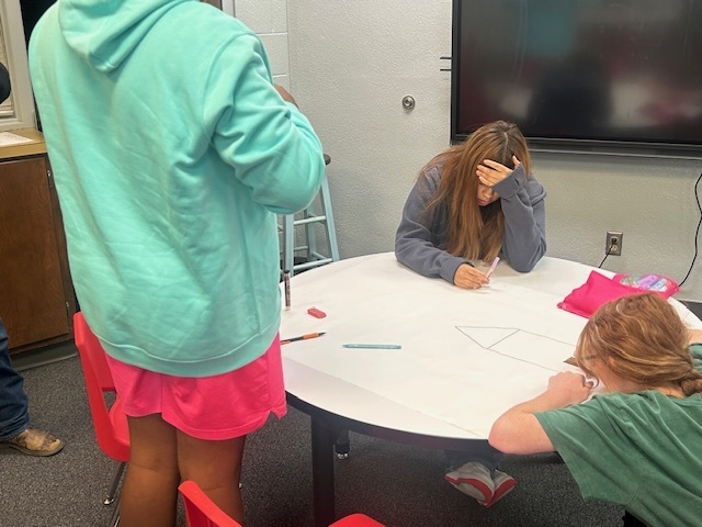 Daniela, Mason, and Bernice work on modeling what was happening an hour before the precipiation.