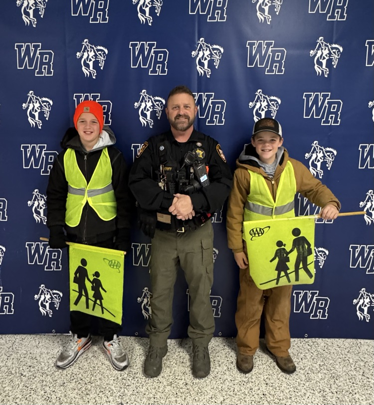Two safety patrol members and our SRO.