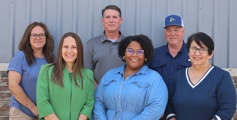 Same building, original name: Esther Hernandez, Dr. Laurie Sharp, Shawn Fonville, Mischa Norris, Tommy Roach, and Janie Guerrero stand in front of the Western Texas College Opportunity Center at  2210 25th Street in Snyder.