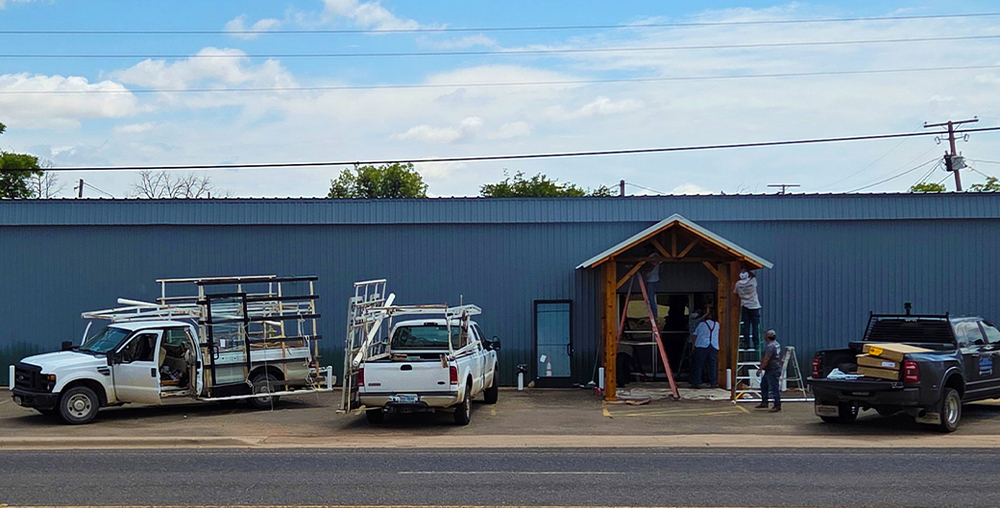 Contractors work on the entrance to WTC College off the Square.