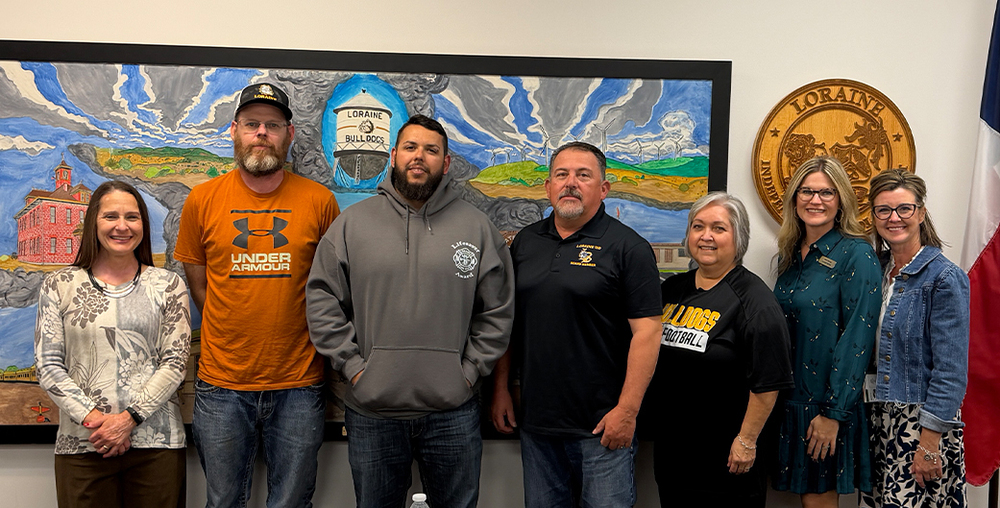 WTC President Dr. Laurie Sharp (left) and WTC Dual Credit and Course Sharing Director Molli Fleming (second from right) with the Loraine ISD Board of Trustees.