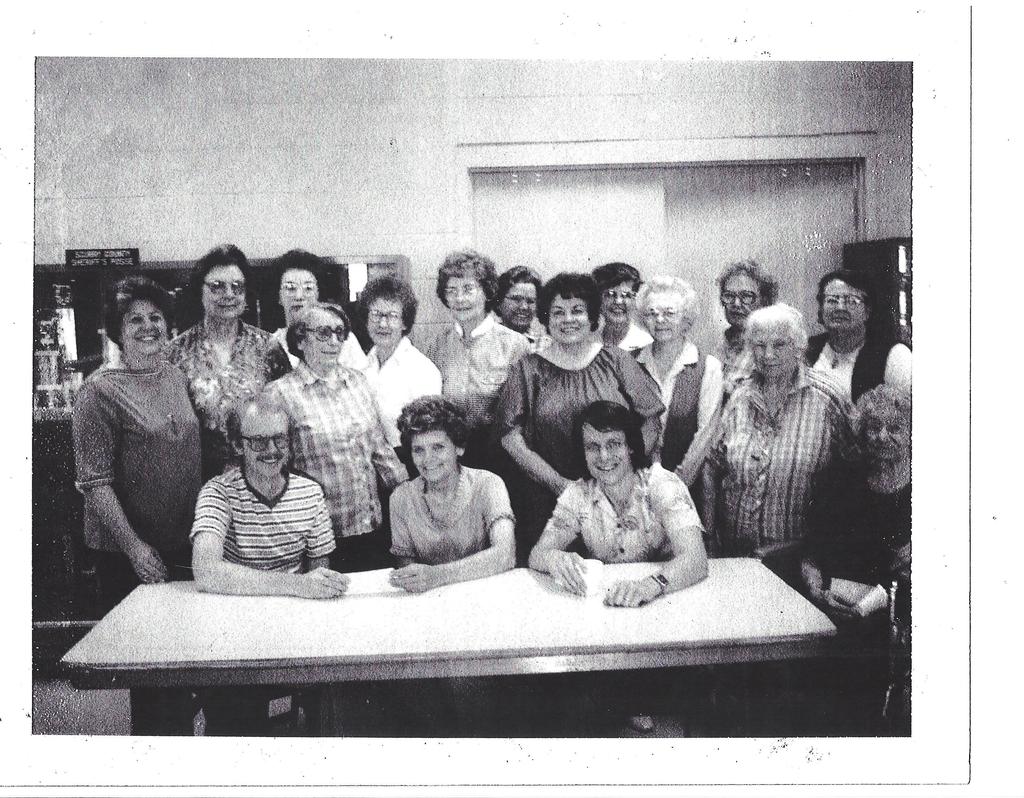 Members of the Palette Club of Snyder signing the scholarship documents.
