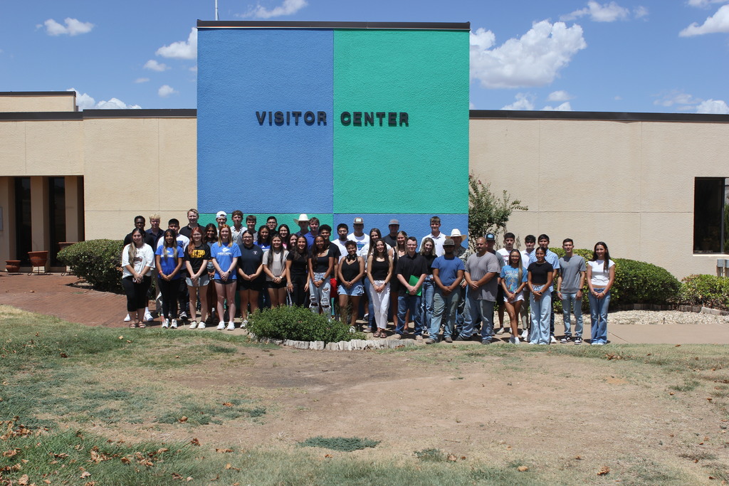 The 2024-2025 WTC Foundation scholarship recipients pose for a group photo in front of the Visitor Center.