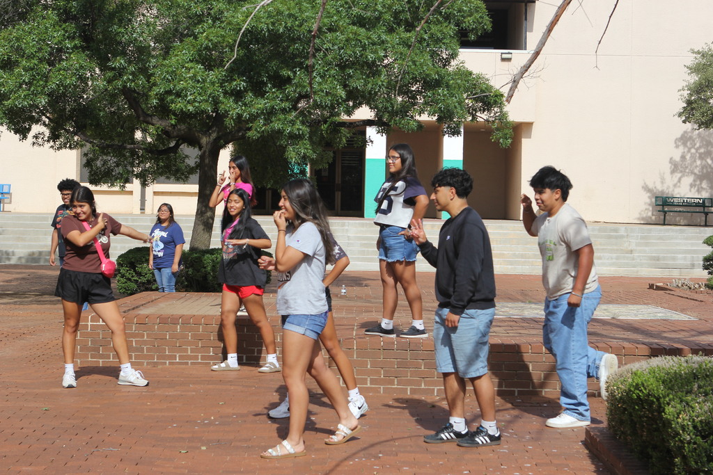 Upward Bound students smile while playing a game of "Statue."
