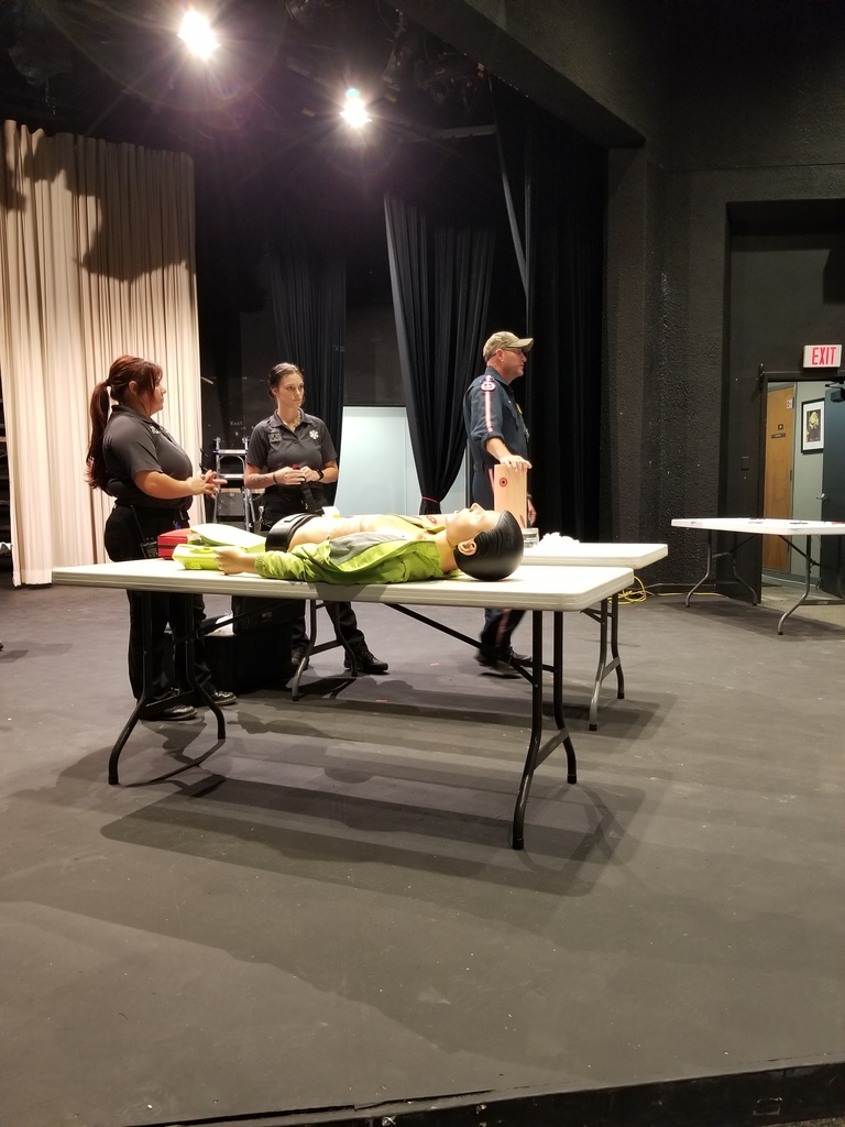 Jason G. , D'Layna, and Zowie demonstrate a Stop the Bleed technique.