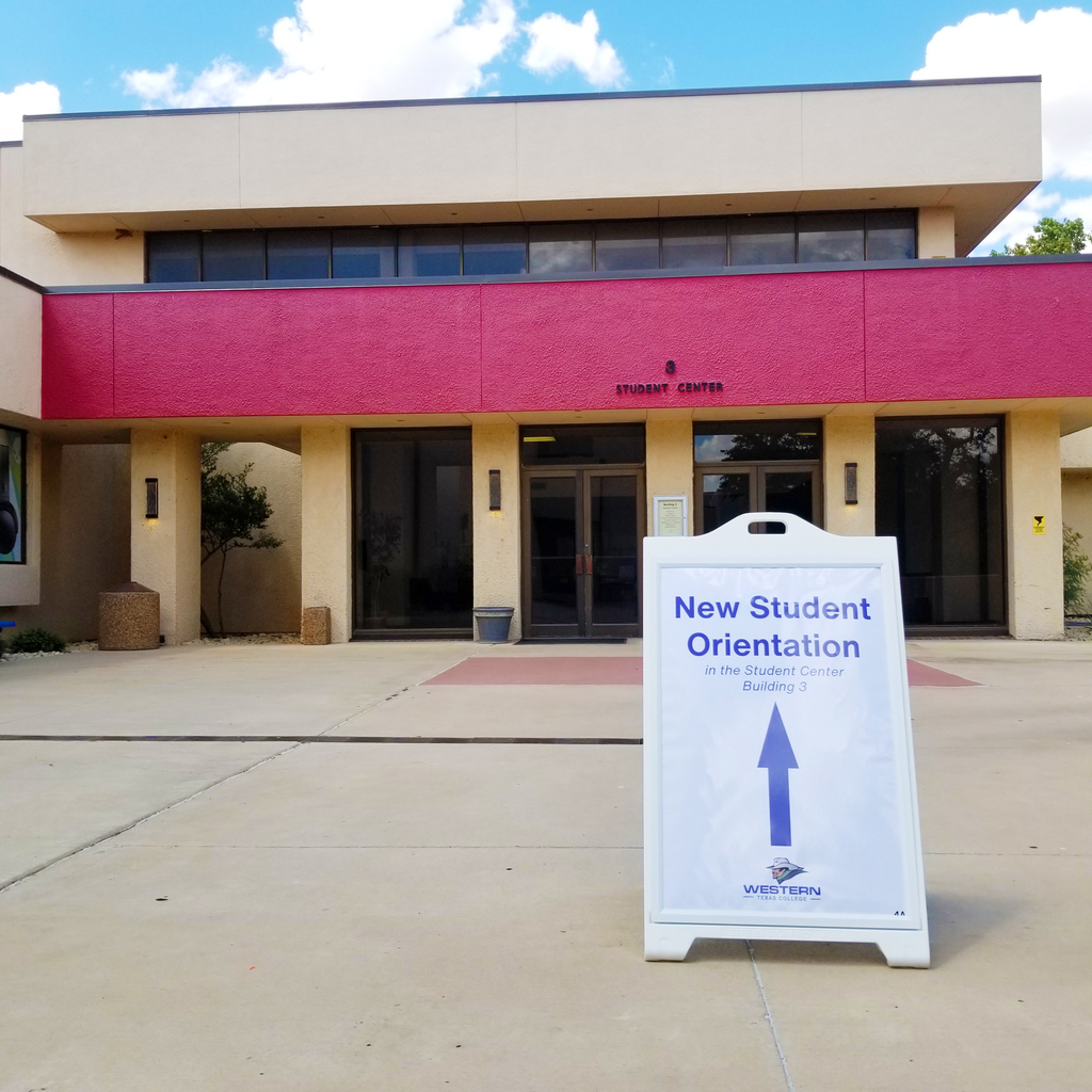 A sign points to the Student Center for Orientation.