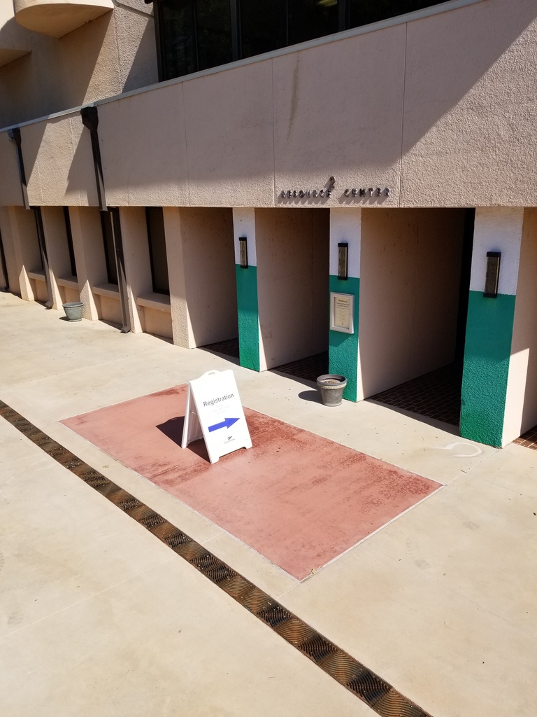 A sandwich board sign points to the entrance of the Library.