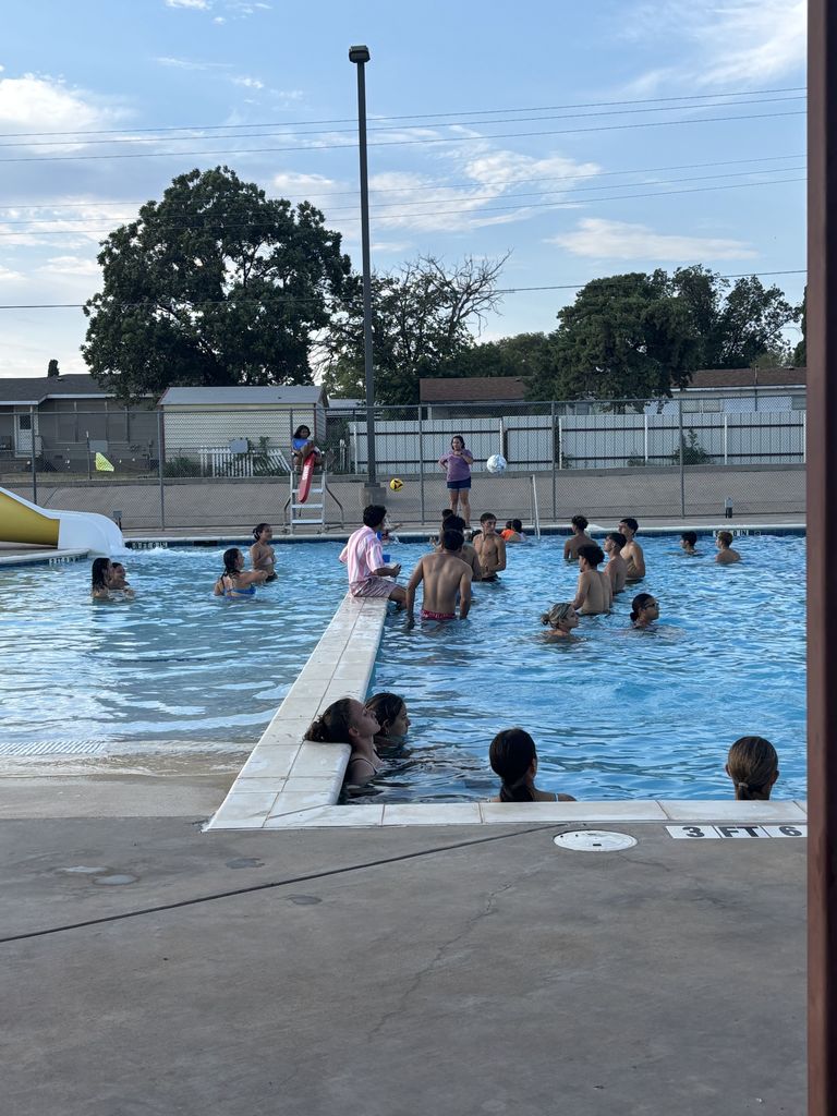 Students swimming in the pool.