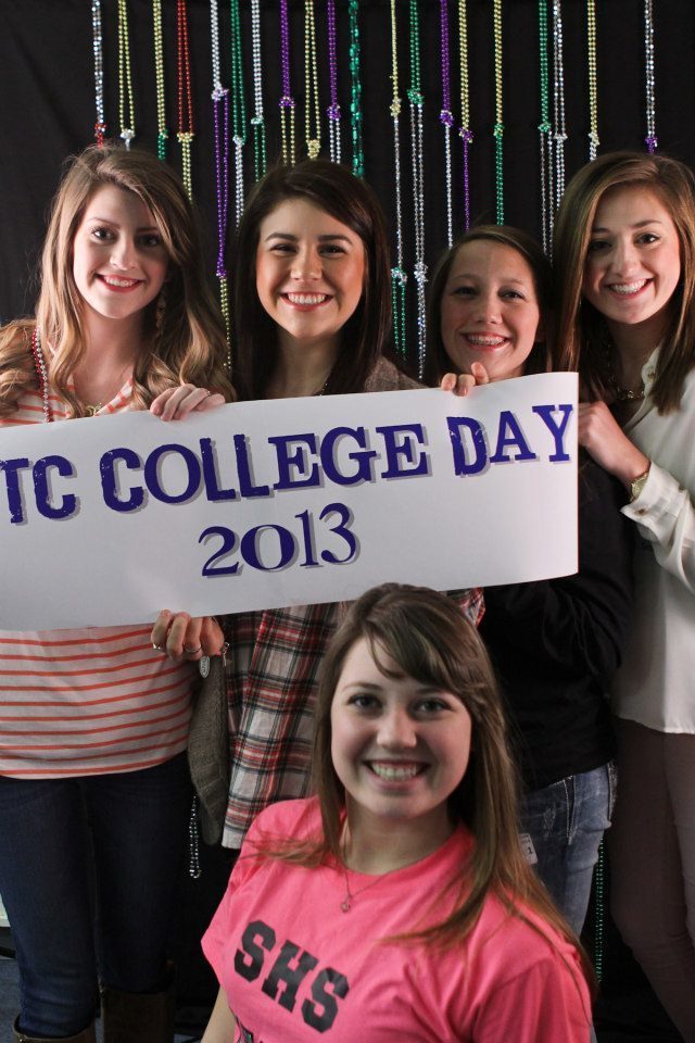 Students holding WTC College Day banner