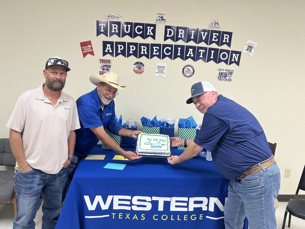 3 people posing with cake for Truck Driver Appreciation event