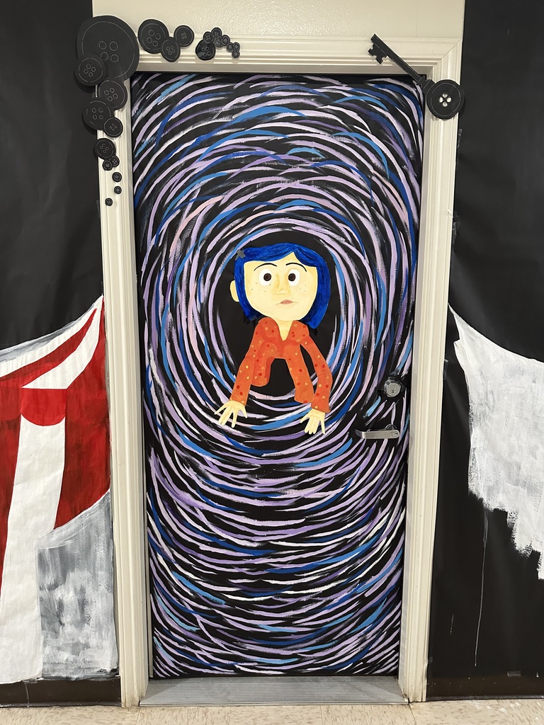 A dorm door decorated for Halloween with a girl emerging out of a bevy of circles on the door.