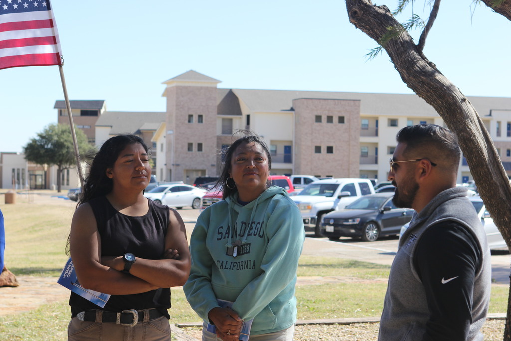 Veterans chat outside the Museum after the ceremony.
