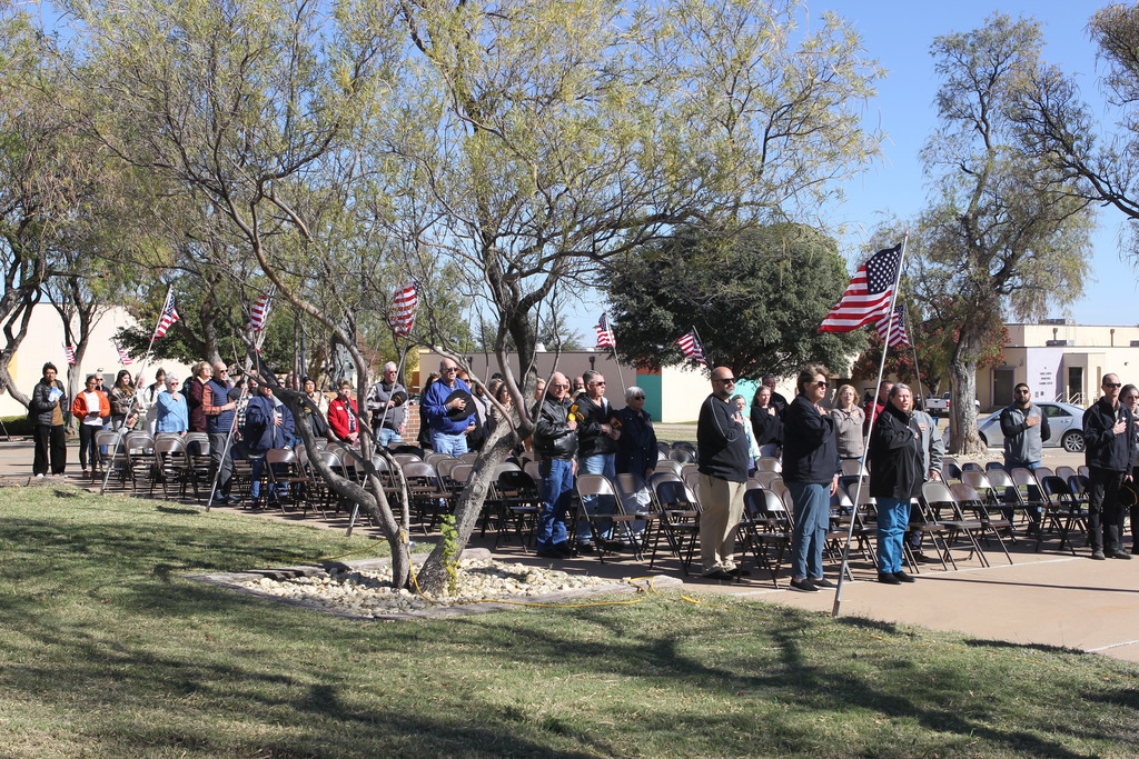 Audience stands for the national anthem during the Veterans Day Ceremony at Western Texas College.