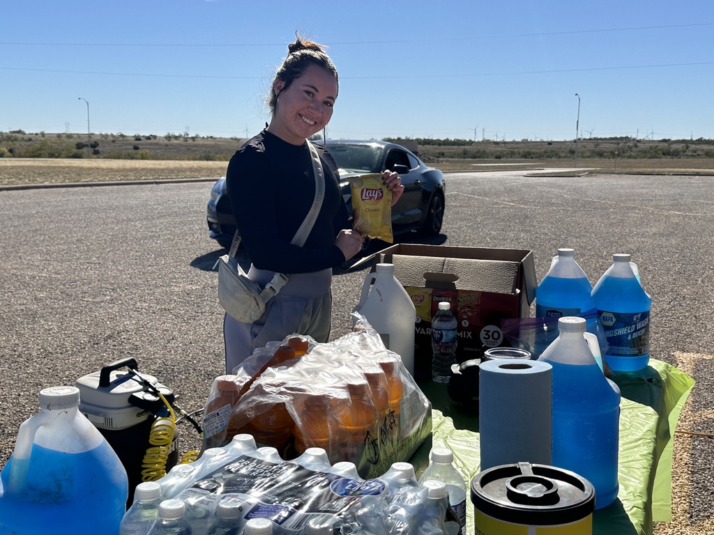 A student holds up a bag of chips at the Safety Check.