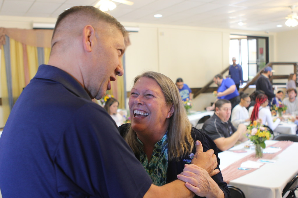 Dr. Beebe laughs with Marc Daniels from Great Western Dining.