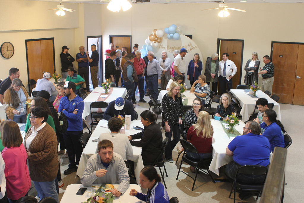 Guests at the party, chat eat, and mingle in the Visitor Center.