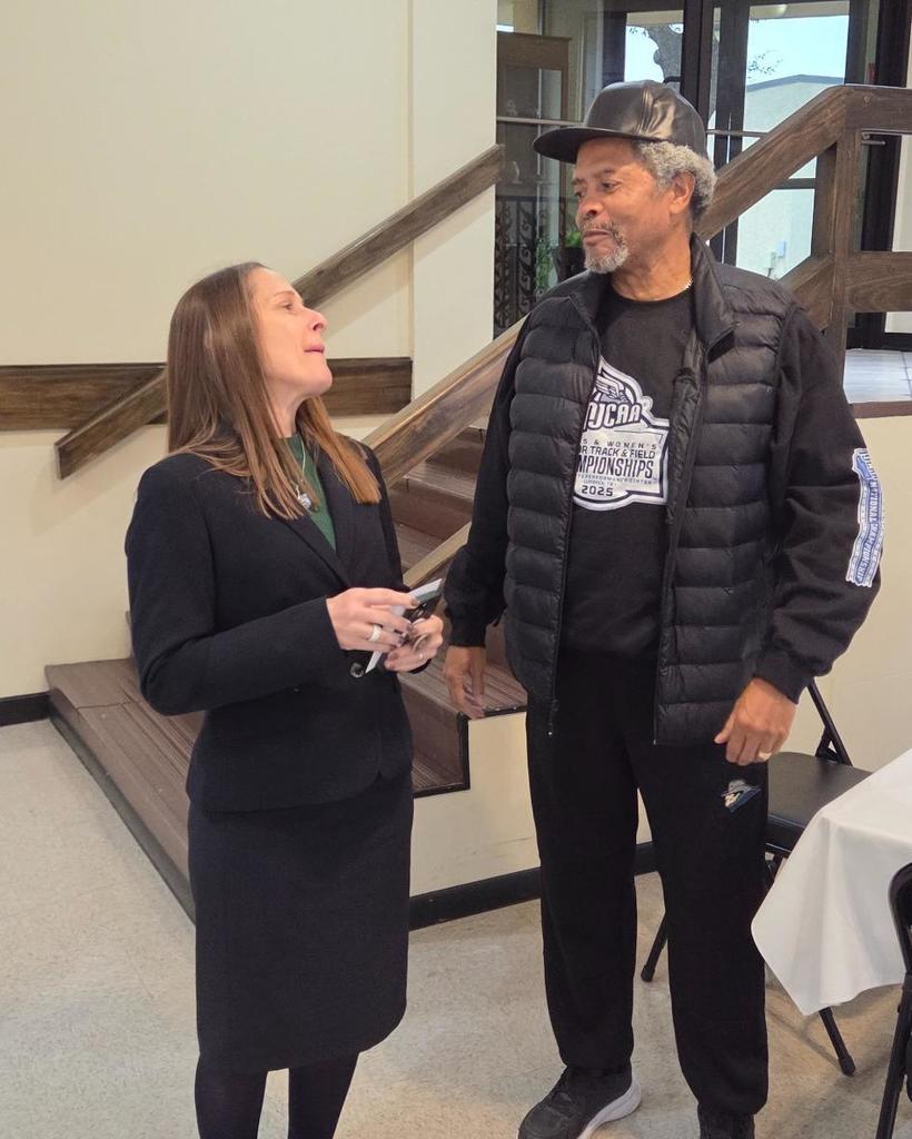 Dr. Sharp laughs with Coach Williams.