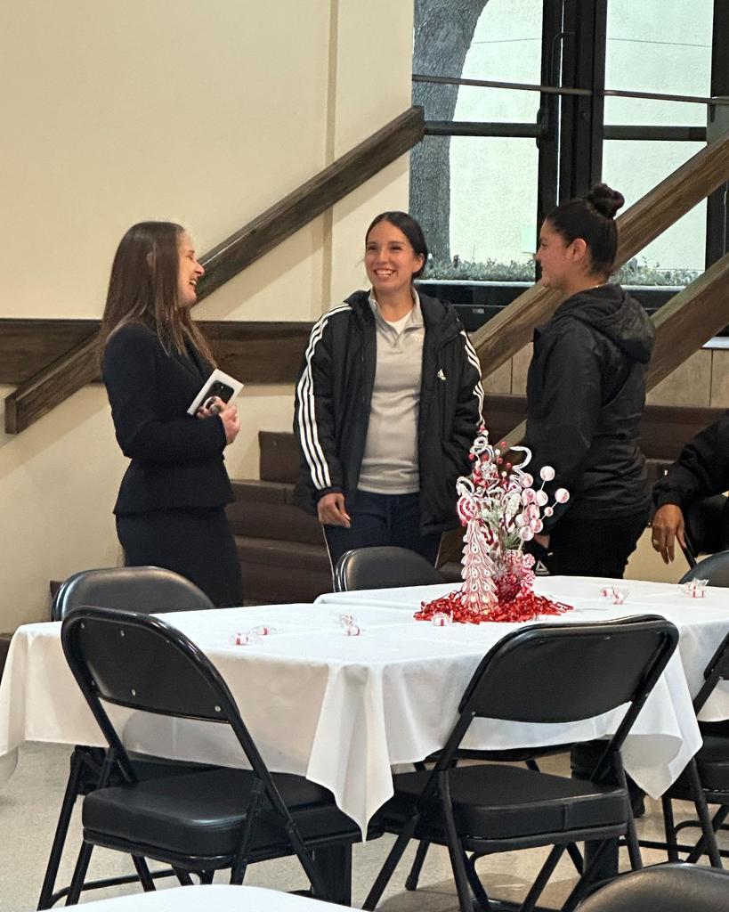 Dr. Sharps laughs with the Womens' Soccer coaches.