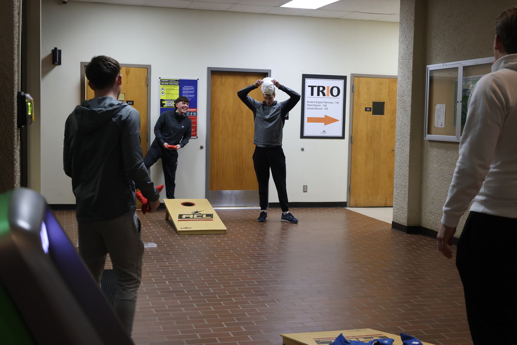 Students compete in cornhole inside the WTC Student Center during Game Night.