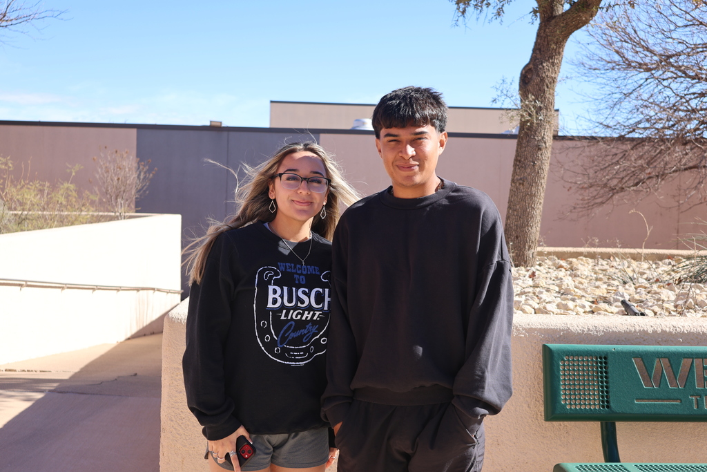 Two Western Texas College students standing together outdoors on campus on the first day of classes.