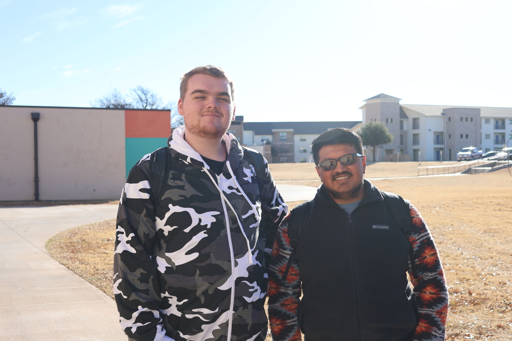 Two Western Texas College students standing on campus, smiling on the first day of the semester.