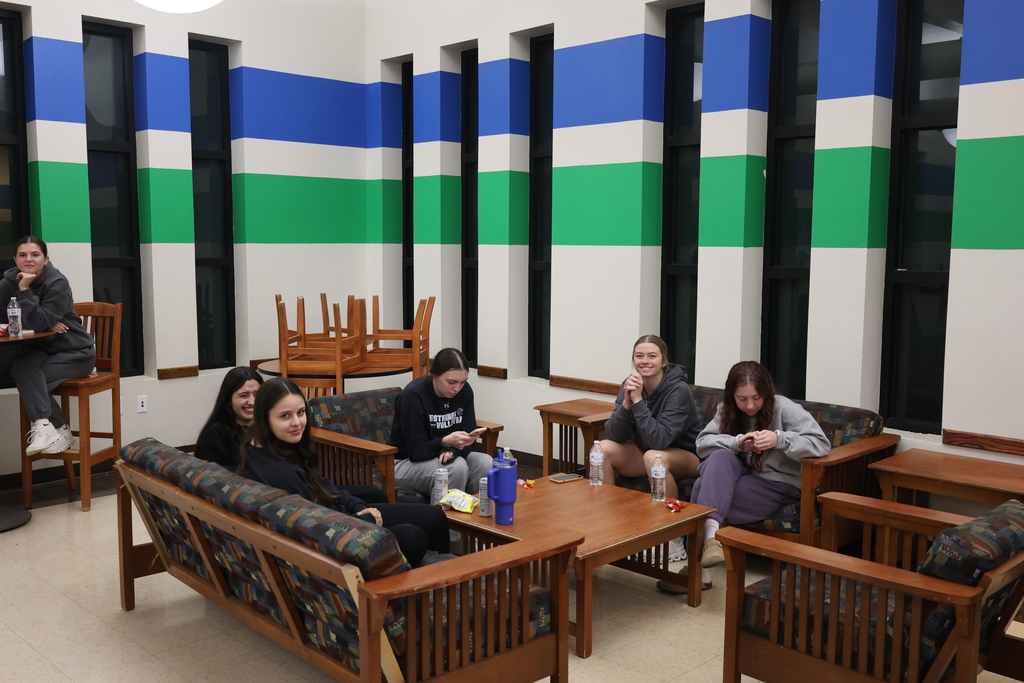 Students gather on couches and high tables, enjoying open mic karaoke at Western Texas College.