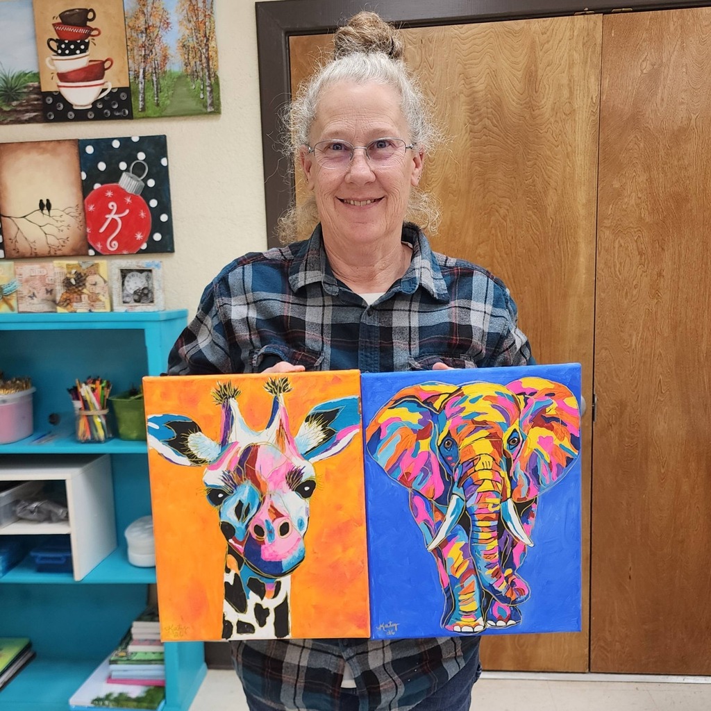 Students with painting of colorful giraffe