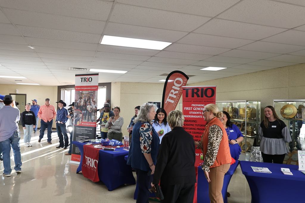 Guests visit TRIO table display during Western Texas College campus event.