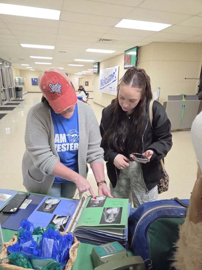 2 People viewing WTC yearbook