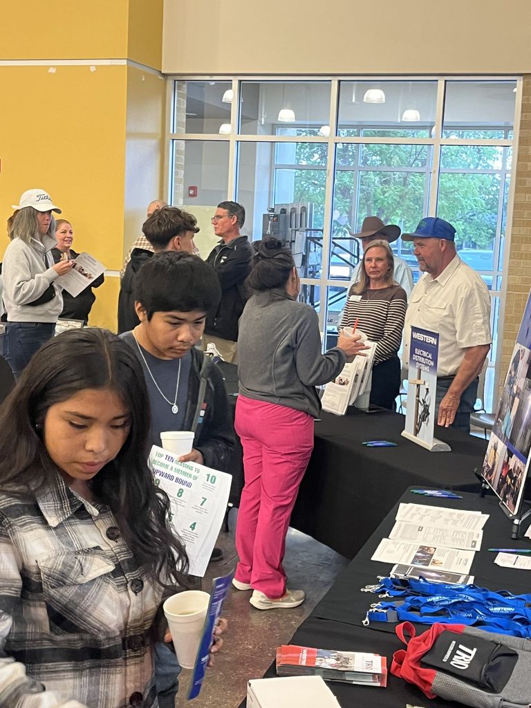 Students visit Western Texas College program tables in campus commons.