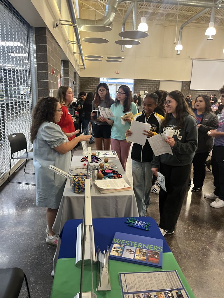 Students visit Western Texas College program tables in campus commons.