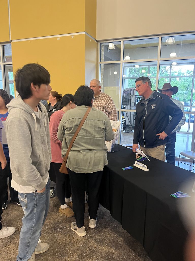Students speak with staff at Western Texas College information booth.